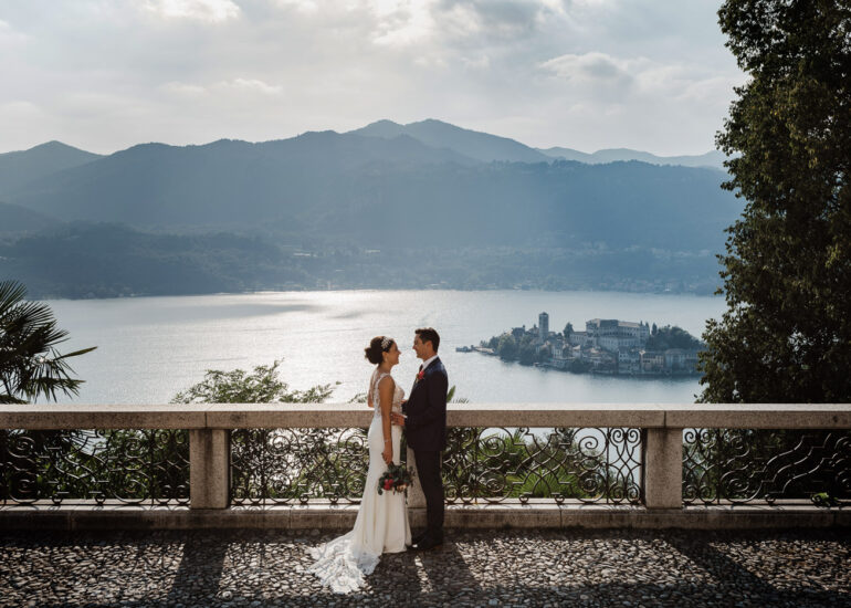 bride and groom with an amazing view of lake orta