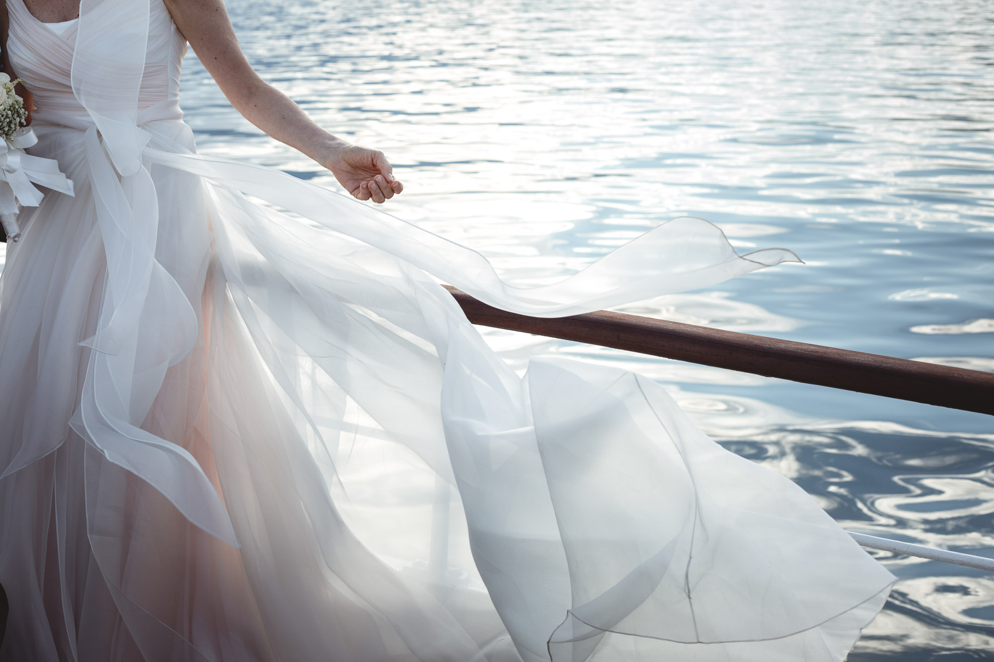 Lake Maggiore wedding photographer, wedding gown and Lake Maggiore in background