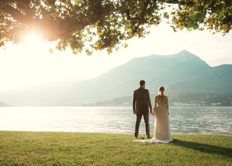 Lake Como wedding photographer, Villa Melzi, bride and groom looking at the lake