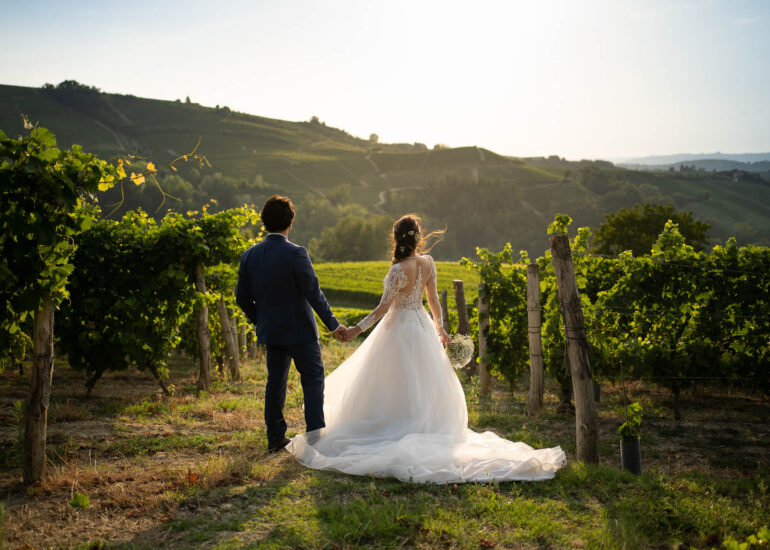 Bride and groom looking at the amazing Piedmont sunset in the Monferrato vineyards